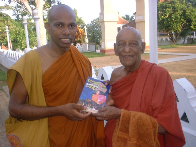 giving a credential book to Devamitta thero at Baddegama temple on 03 June 2006.JPG